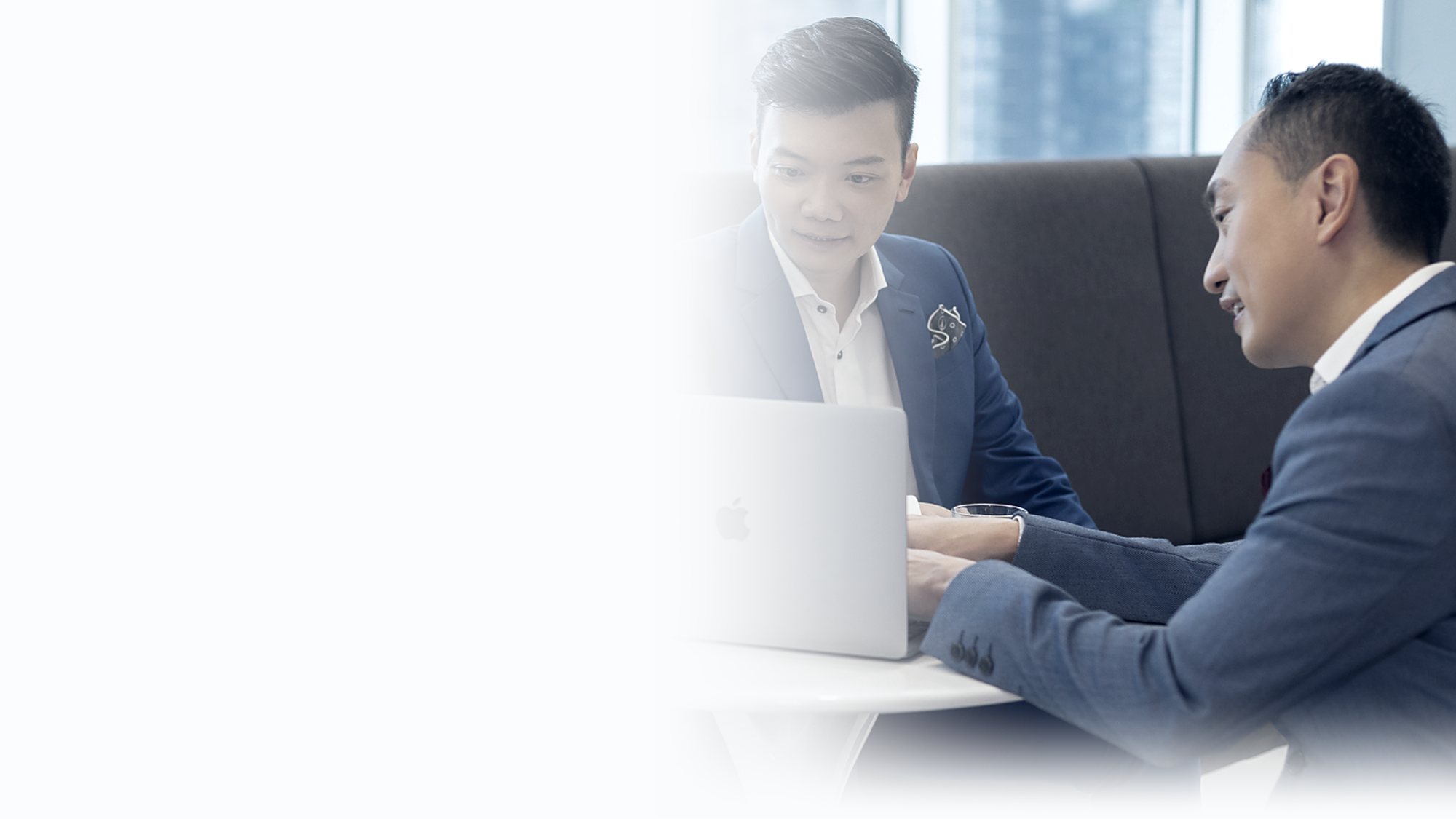 JLO advisers reviewing a client plan together at the firm's Singapore office